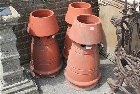 3 terracotta chimney pots(-)